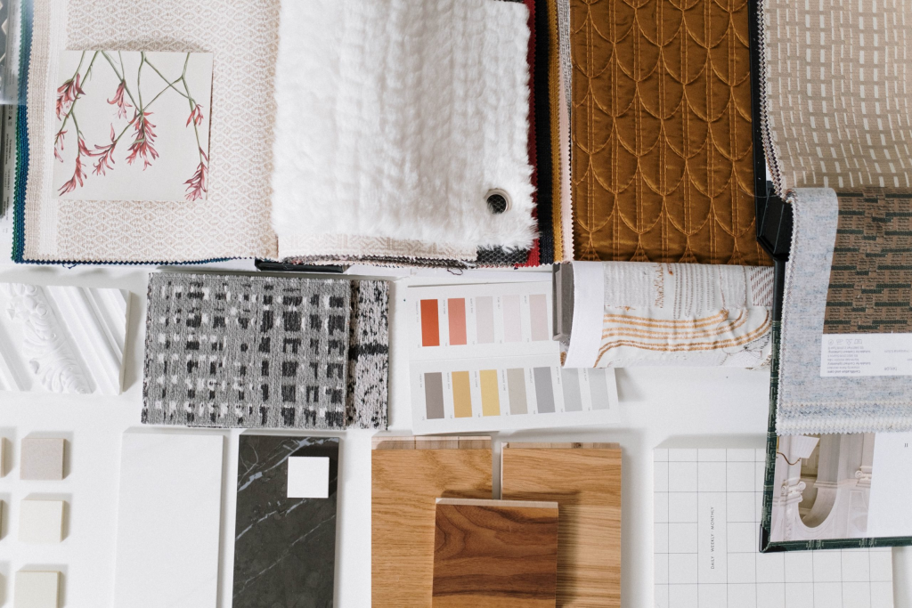 A flat lay of interior design samples on a white table.